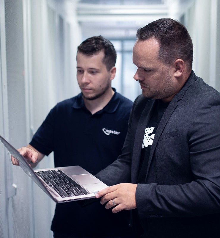 Sales representative Pavel Makel and a member of the support team work closely together.