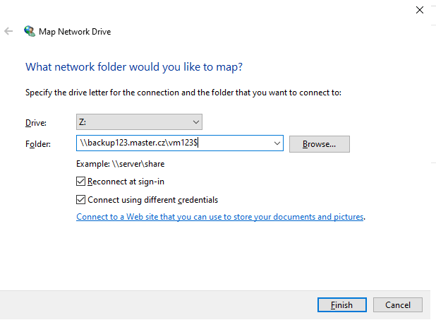 Screenshot showing the window where you select a drive letter and enter the network path to the folder. Both options – Reconnect at sign-in and Connect using different credentials – are ticked in the image, and the Finish button is highlighted.